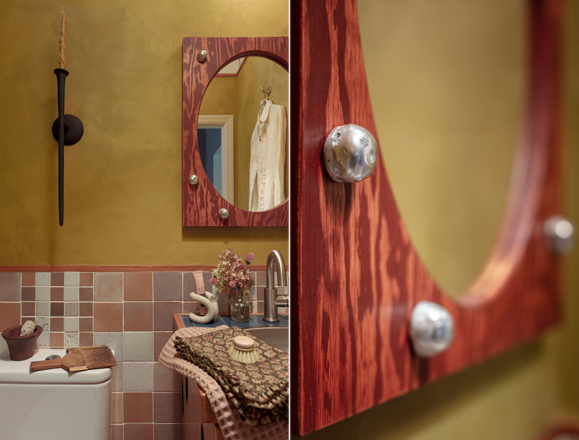 a powder room with soft hued tile