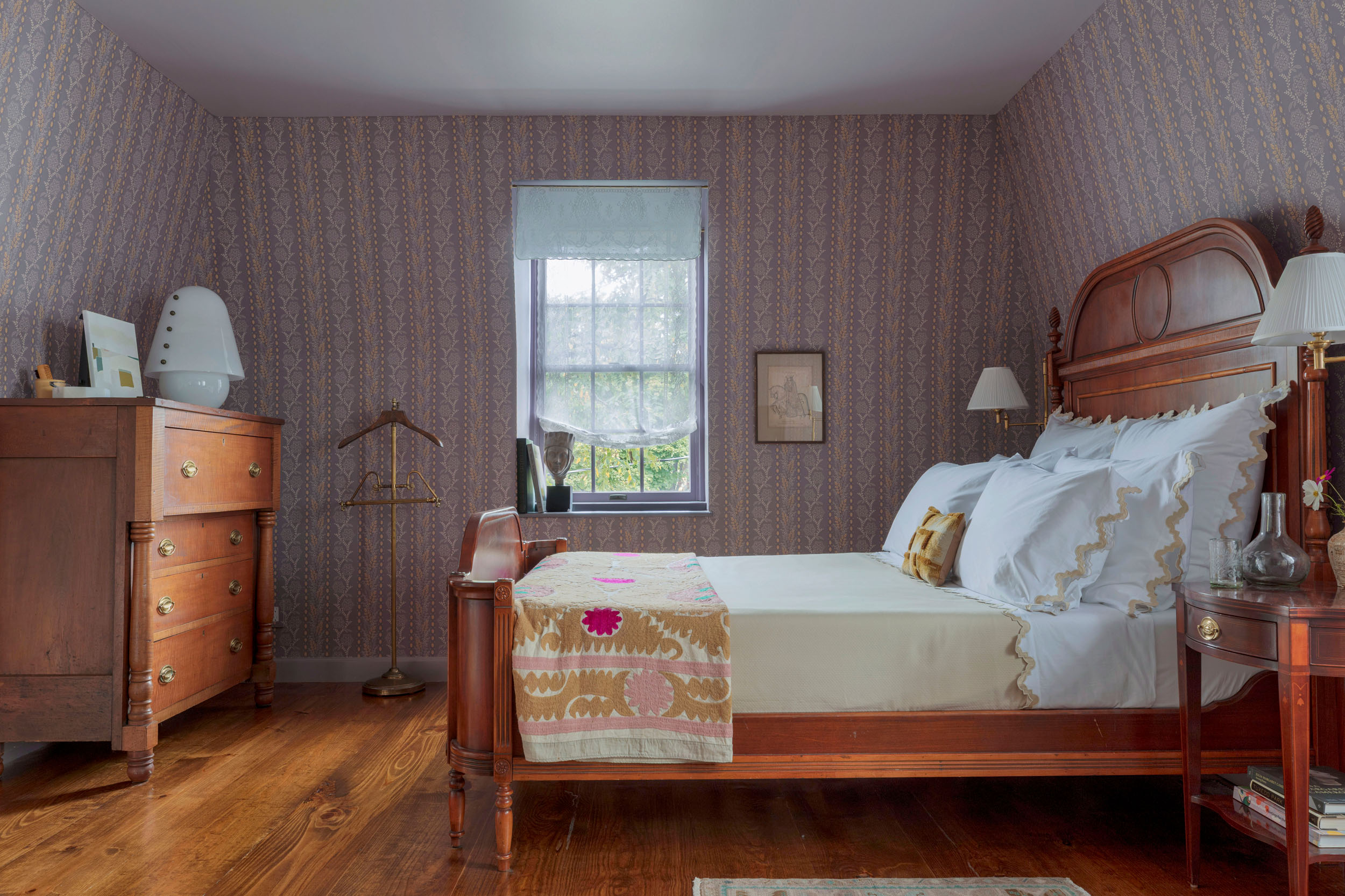 bedroom with purple striped wallpaper