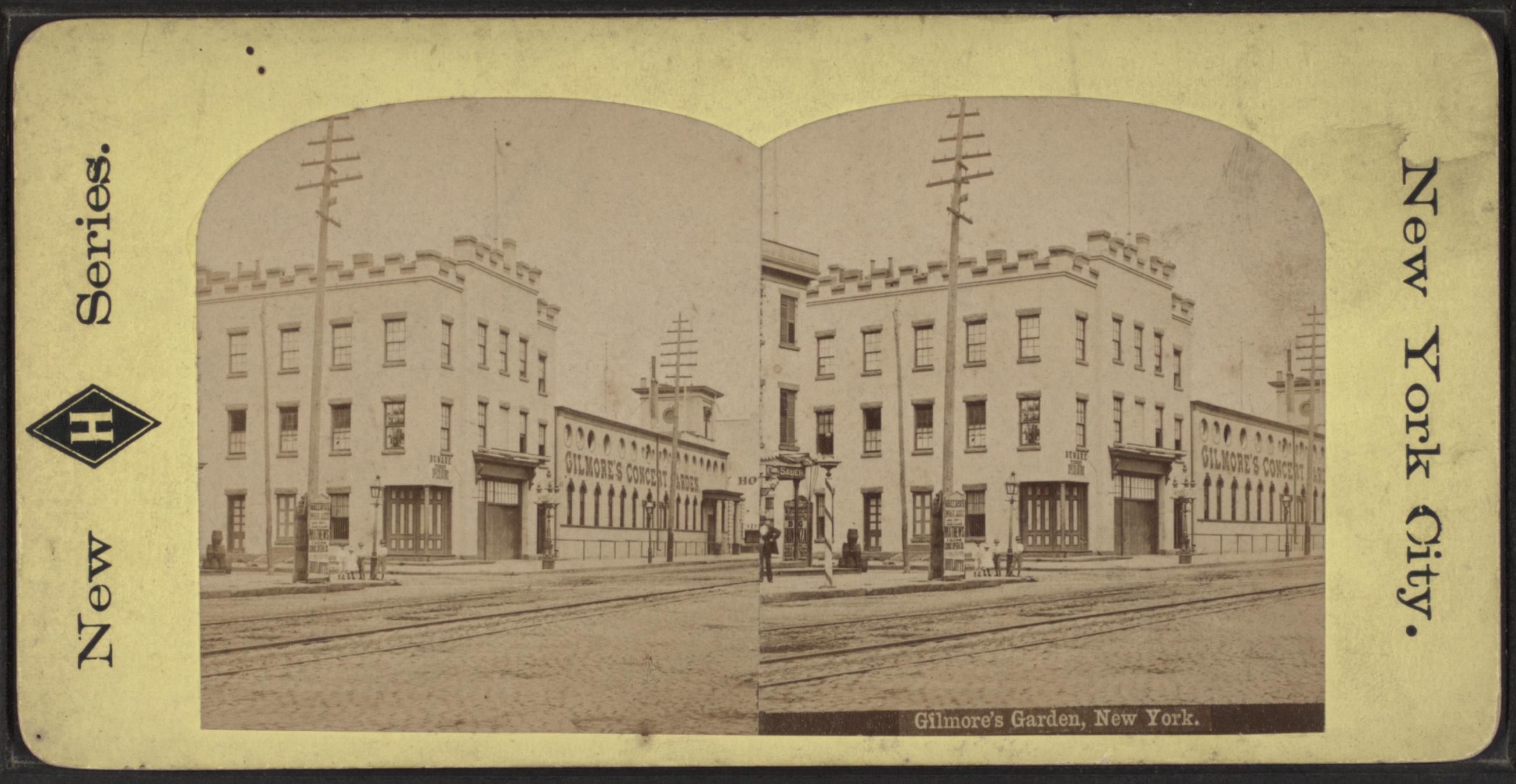 black and white photo showing a low scale building with gilmore's garden painted on the exterior