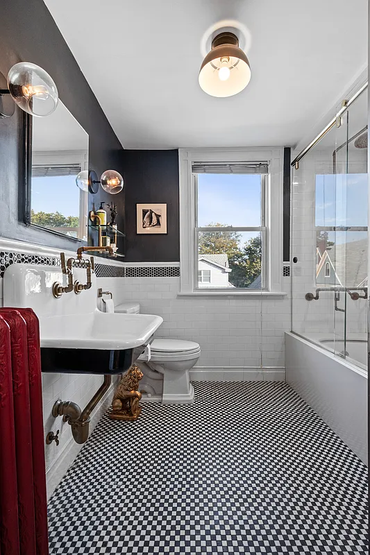 bathroom with black and white floor tile