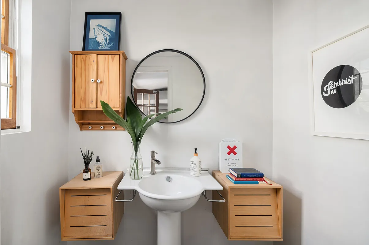 bathroom with white pedestal sink