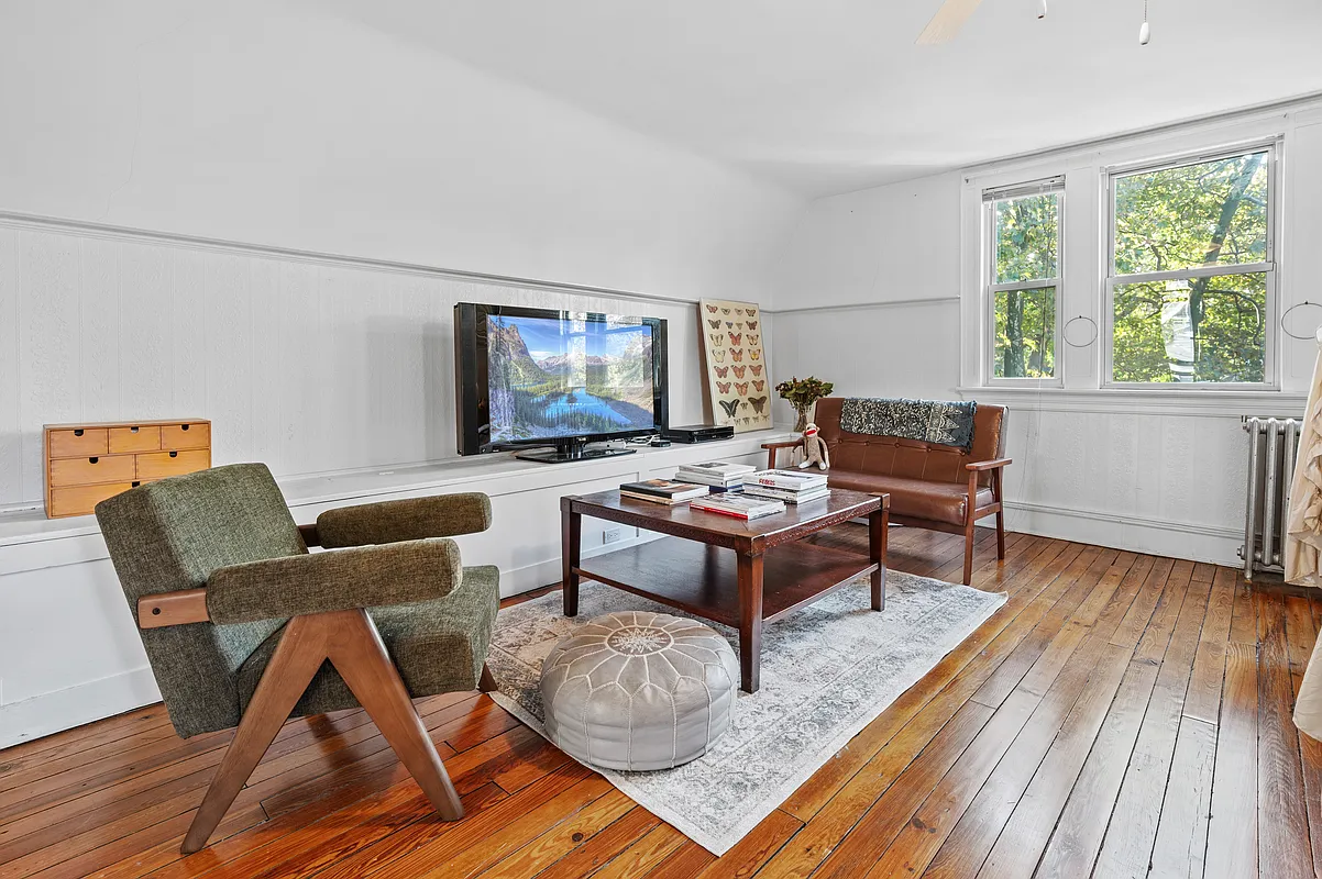 bedroom with wood floor, white walls