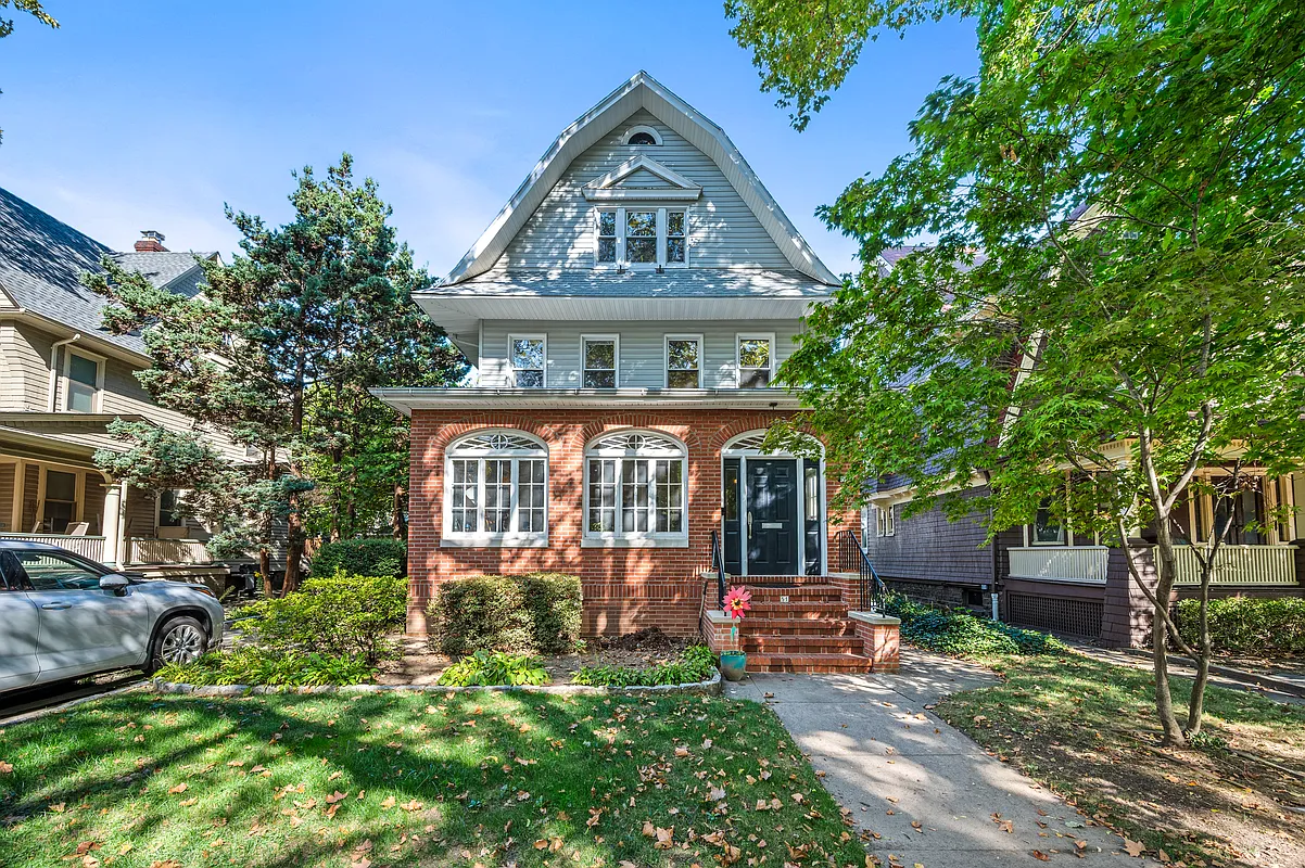 standalone with brick first floor and a gambrel roof