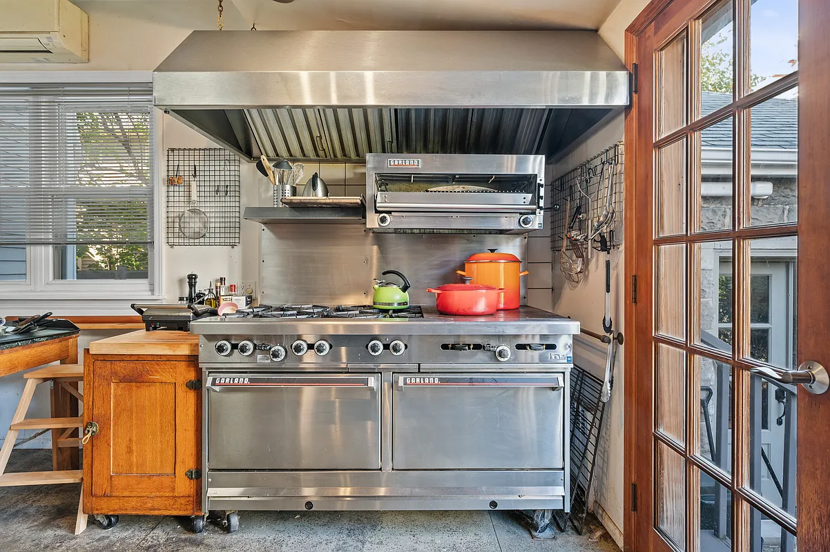 kitchen with industrial stove, hood