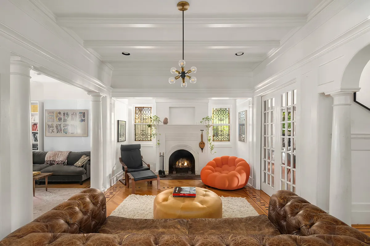 parlor with brick mantel painted white