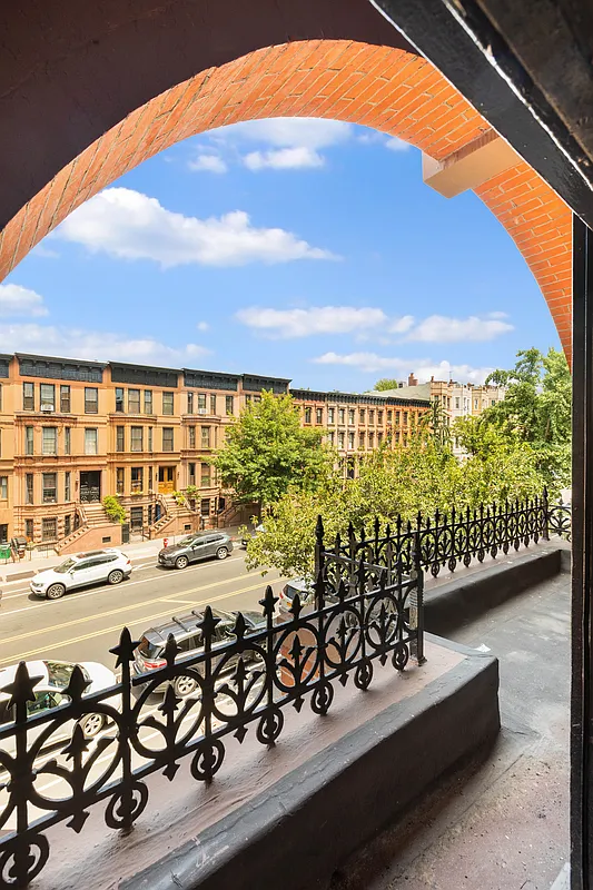 second floor terrace with view out to a brownstone row across the street