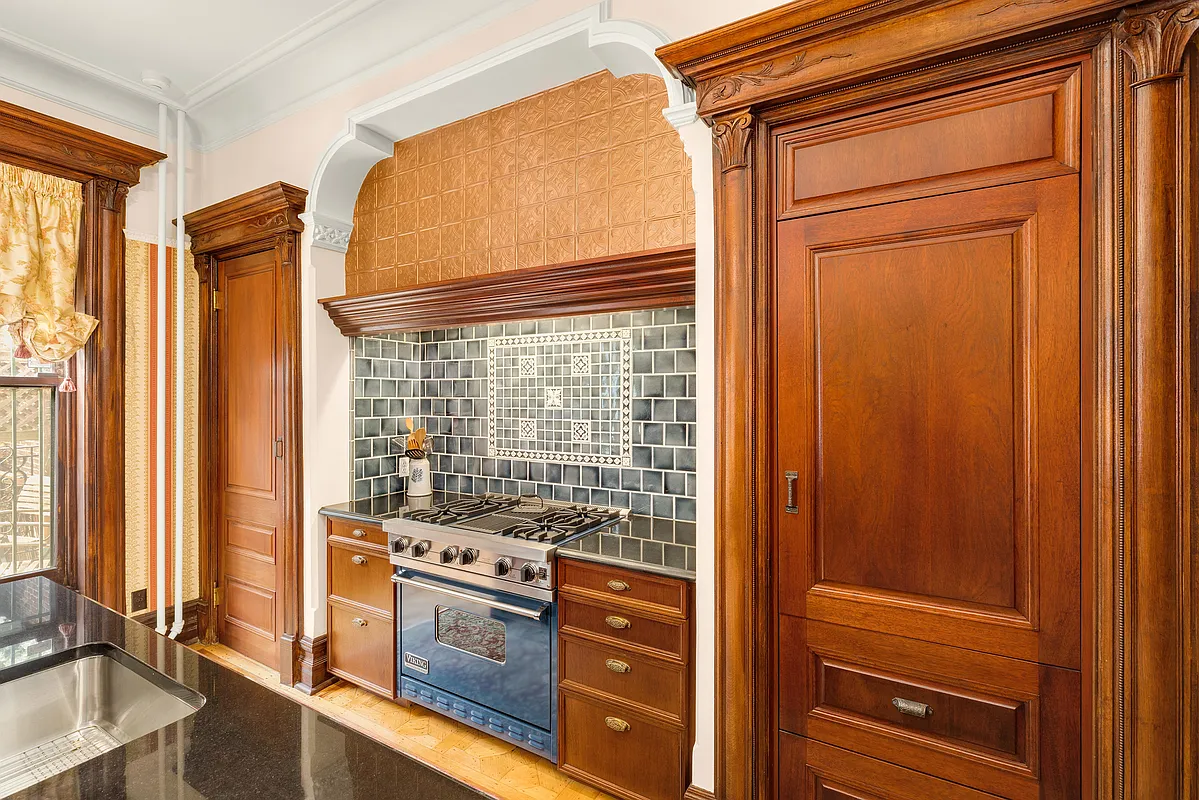 niche in rear parlor outfitted with a modern stove and tilework