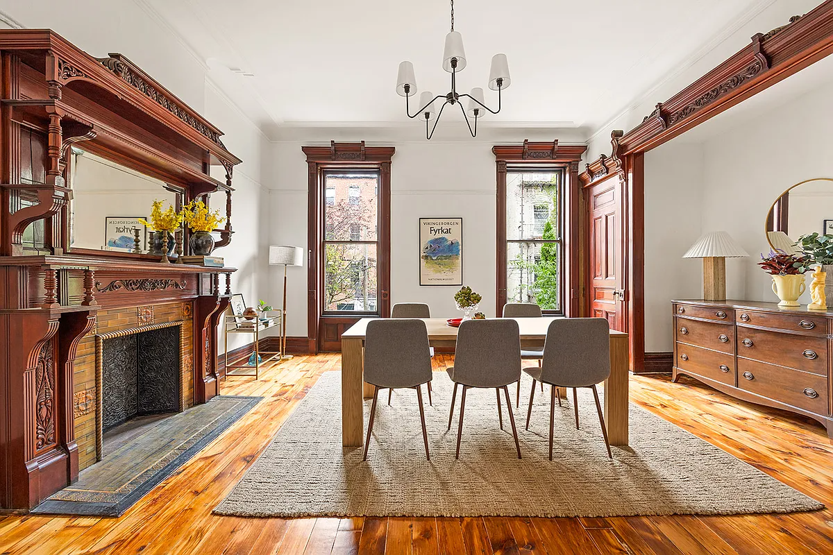 rear parlor with mantel, alcove, moldings, set up as a dining room