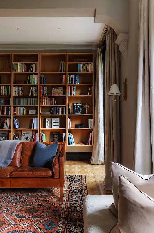den with wall of bookshelves