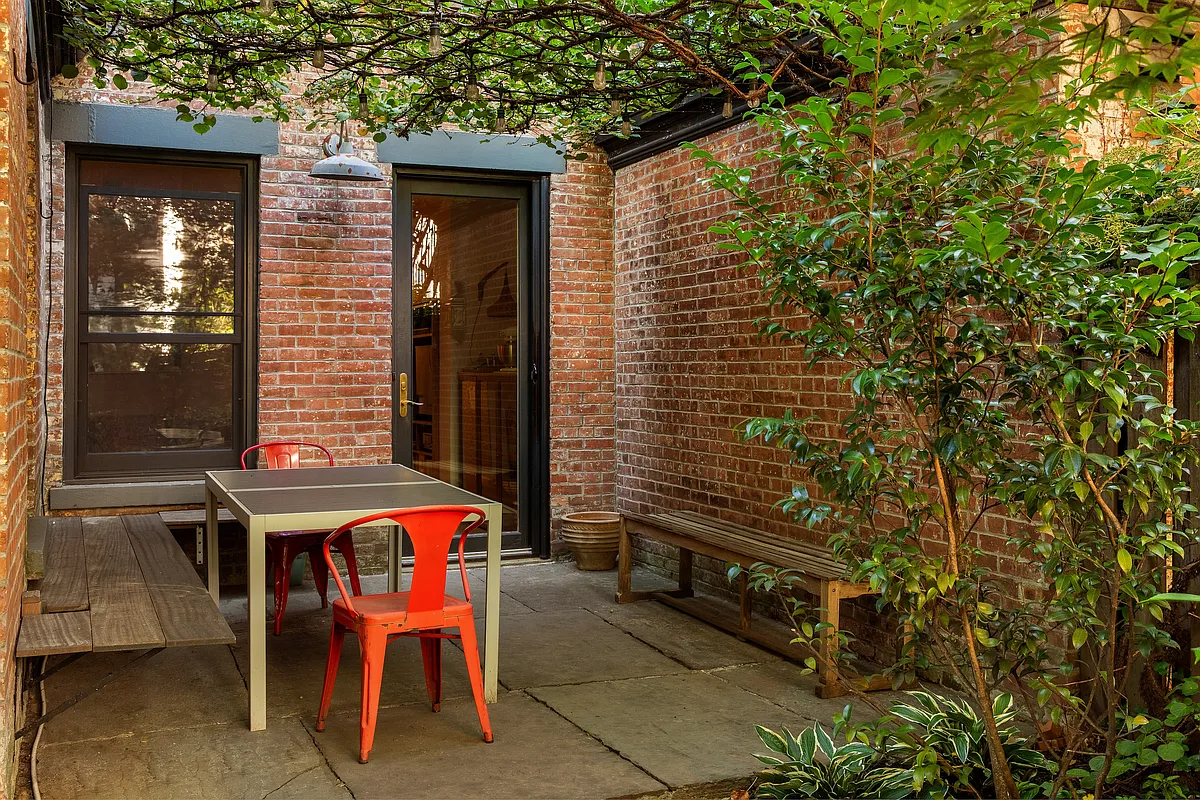 rear yard with patio near glass door to kitchen