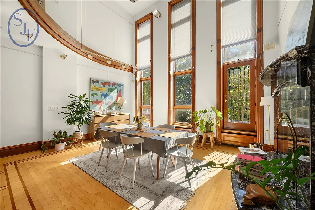 dining room with high ceiling
