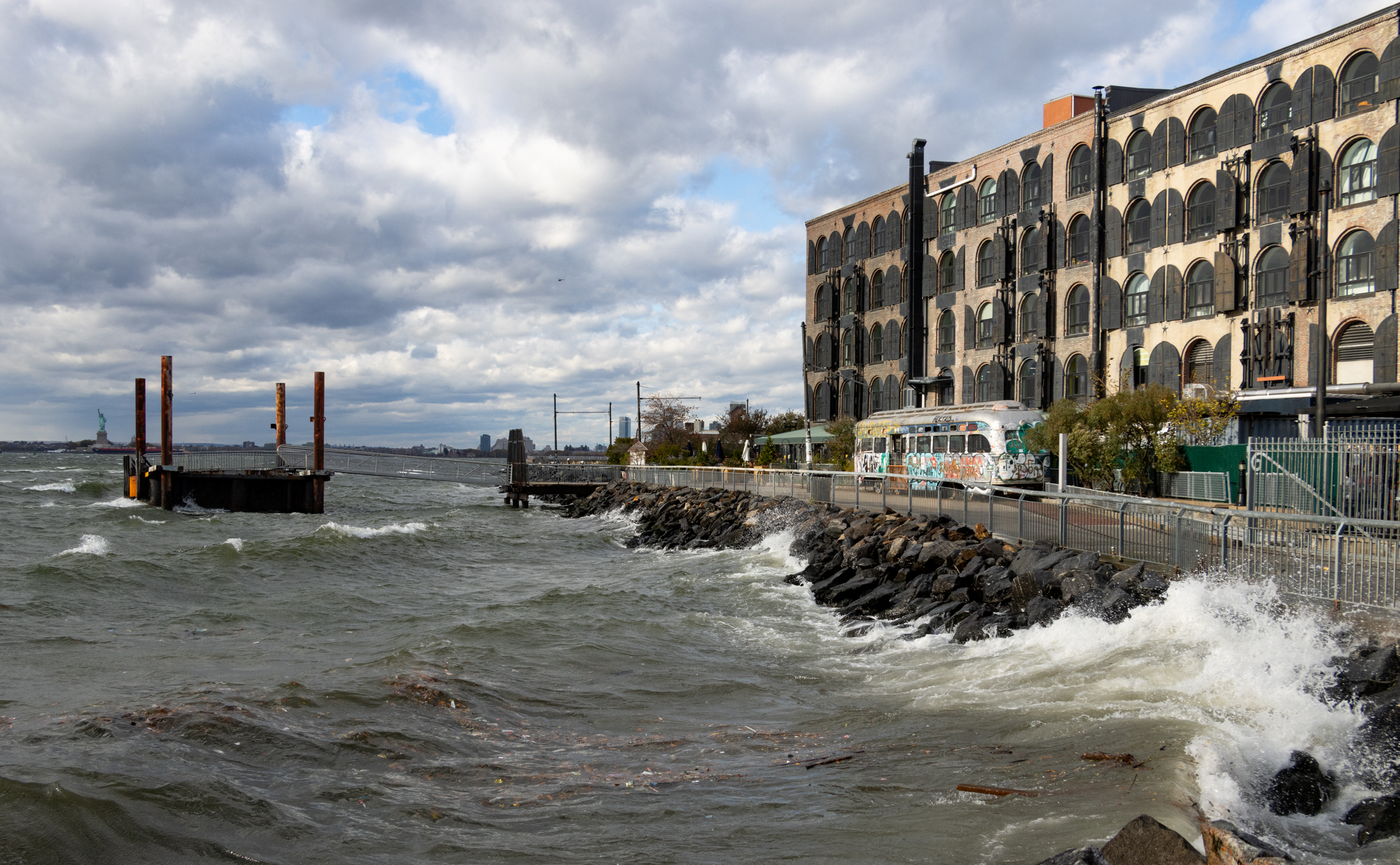 water crashing on the red hook shoreline
