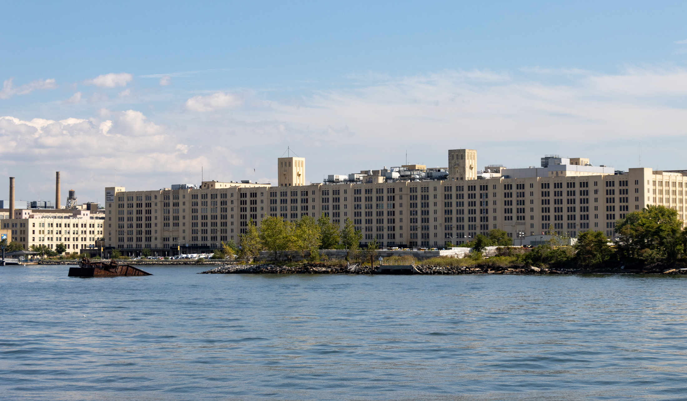 the waterfront in sunset park showing the large yellow complex of the brooklyn army terminal