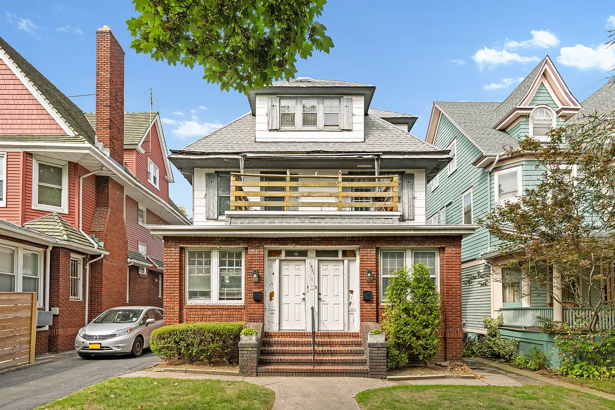 two-family standlone house with brick first level