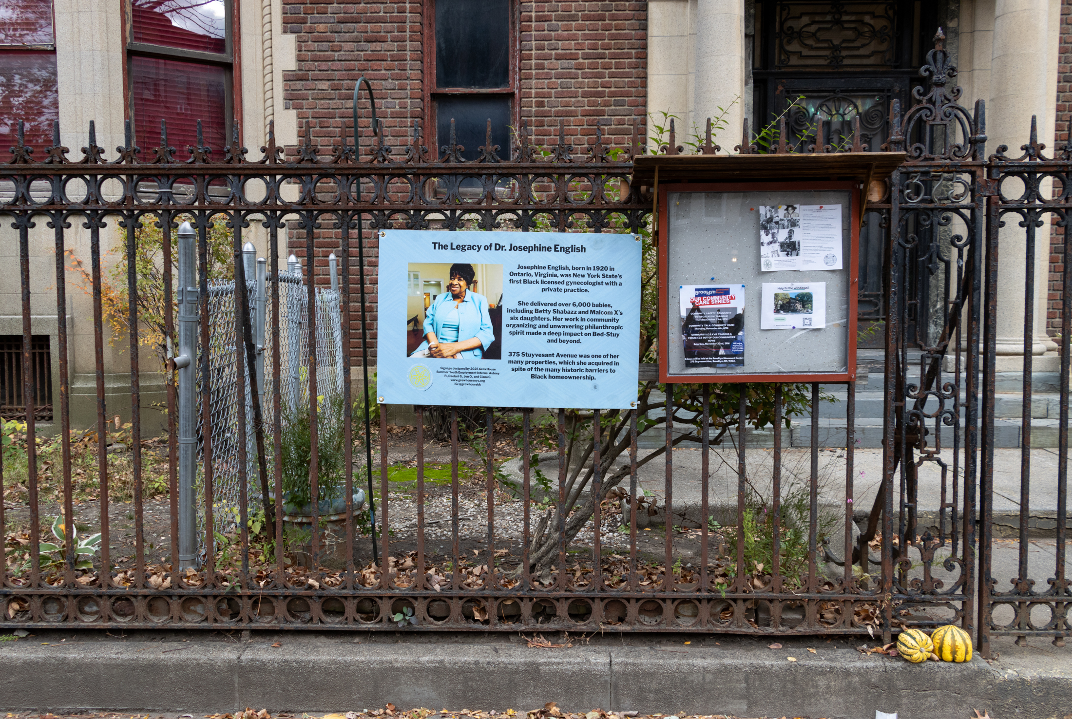 iron fence with signage