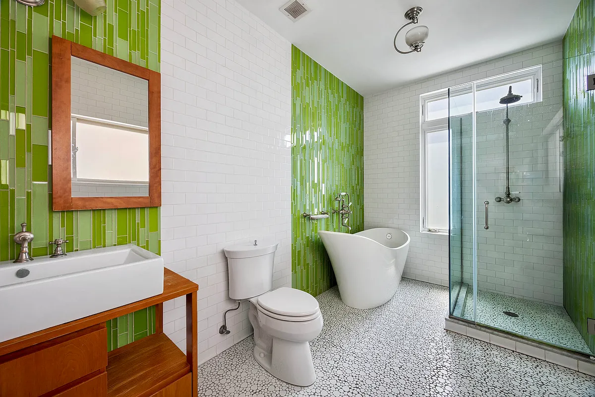 bathroom a soaking tub and a shower and with spring green tile on walls,