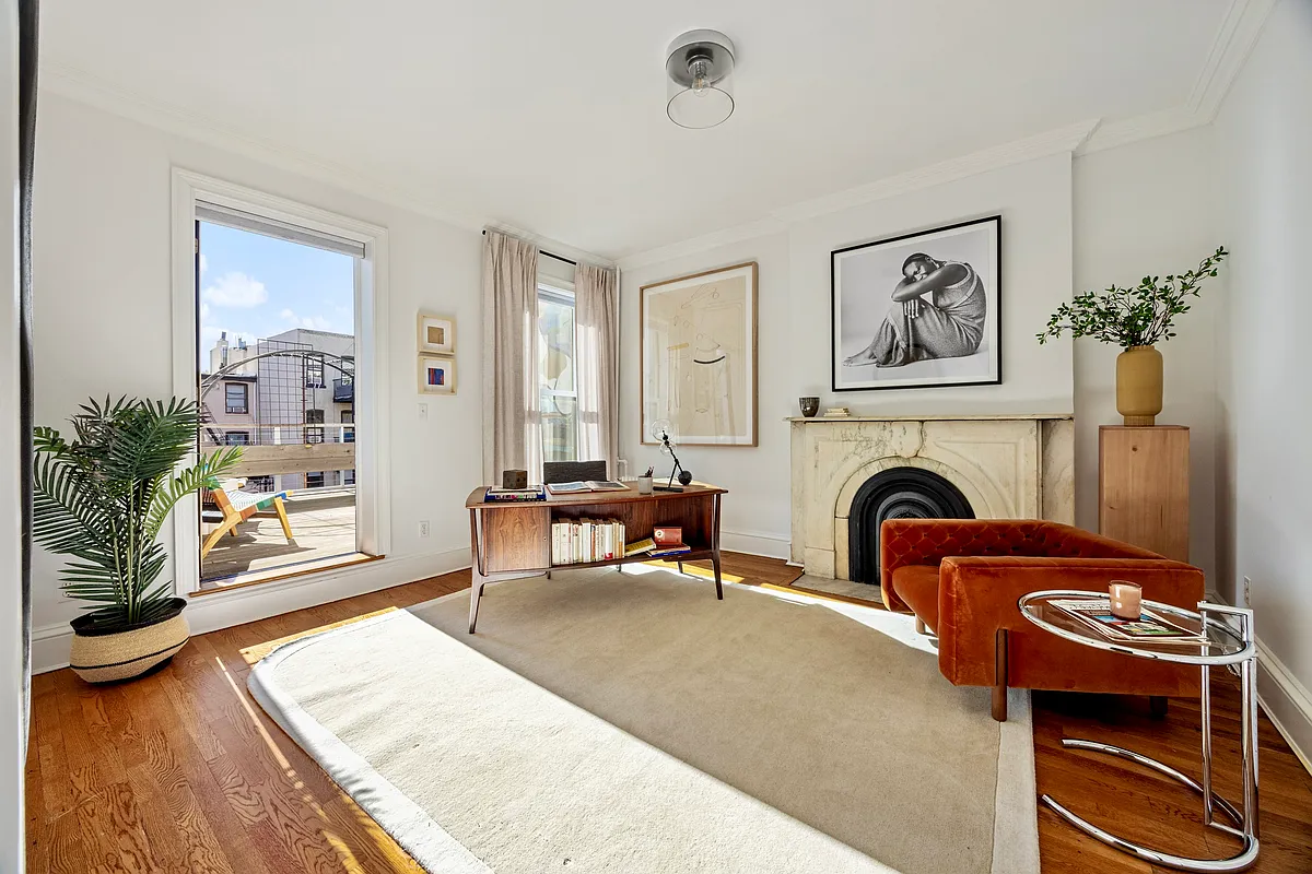 bedroom with access to an outdoor terrace set up as an office