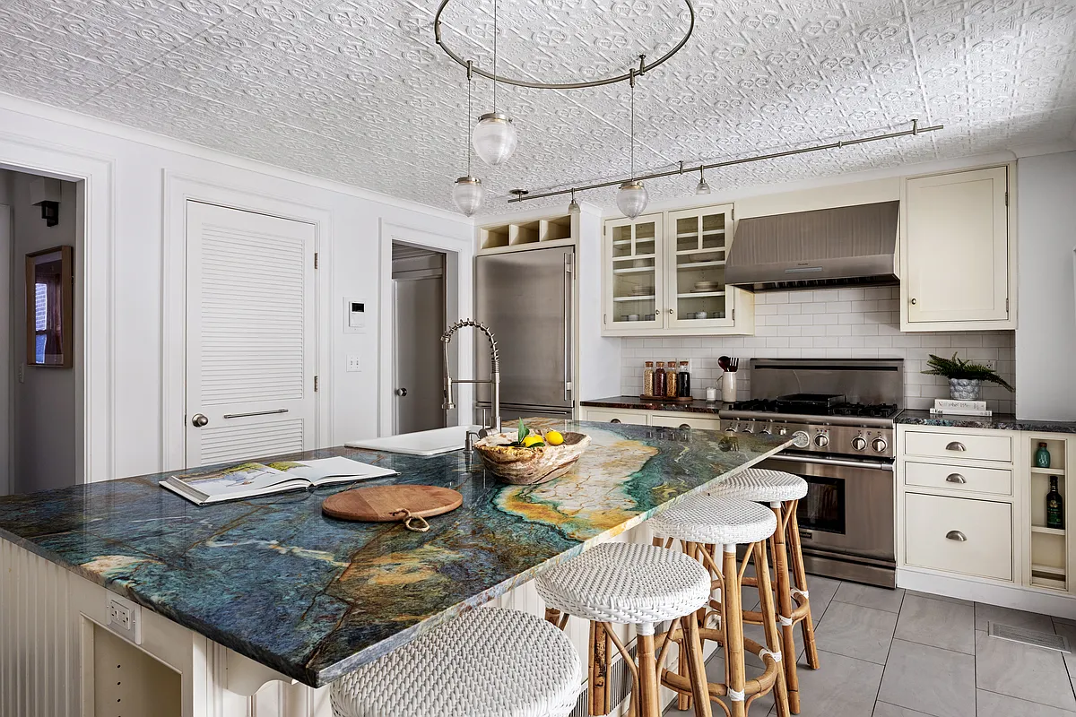 kitchen with tin ceiling, stone topped island