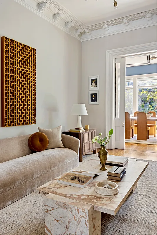 parlor with crown molding, pocket doors