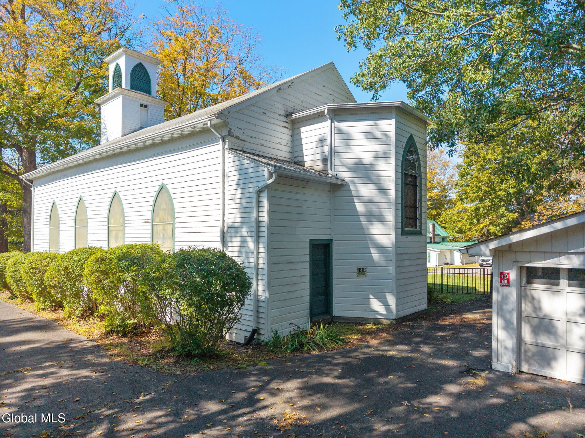 wood frame church with pilasters and gothic windows