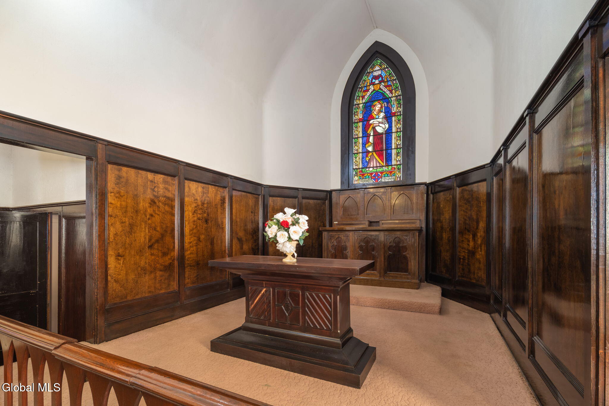 church interior with pews and stained glass windows