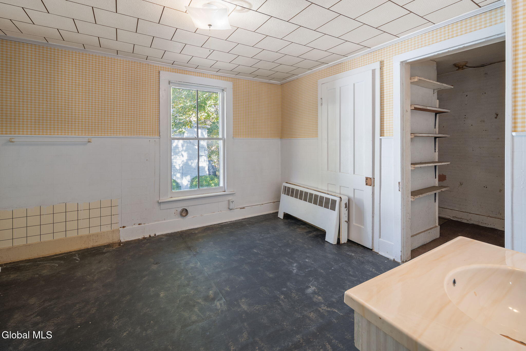 bathroom with white fixtures, dropped ceiling