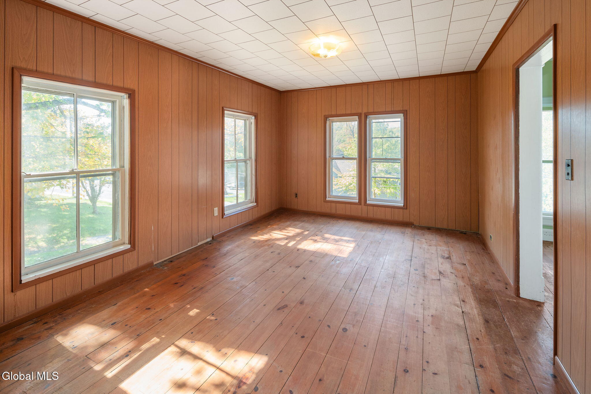 bedroom with paneling