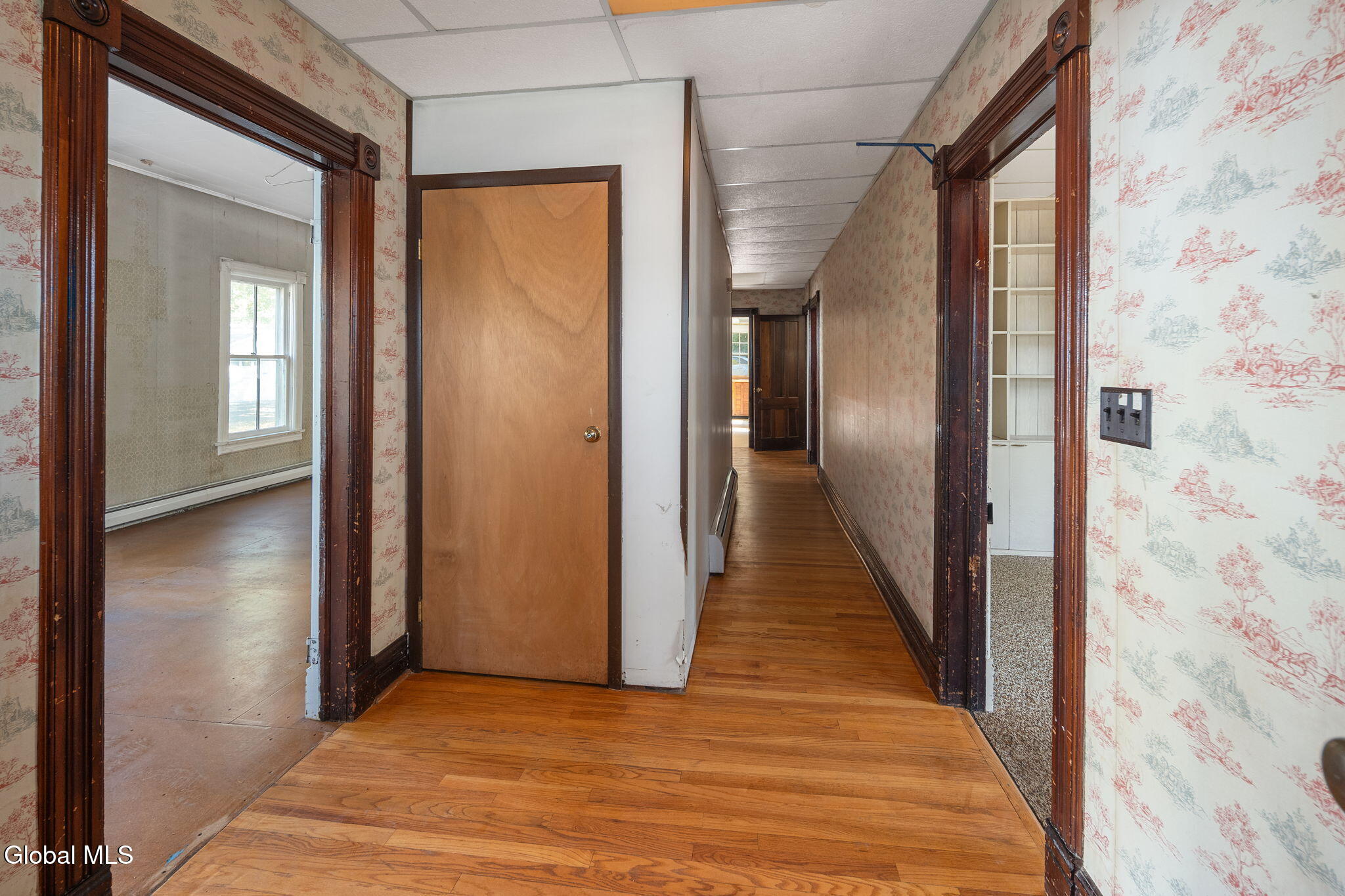 entry hall with vintage wallpaper and dropped ceiling