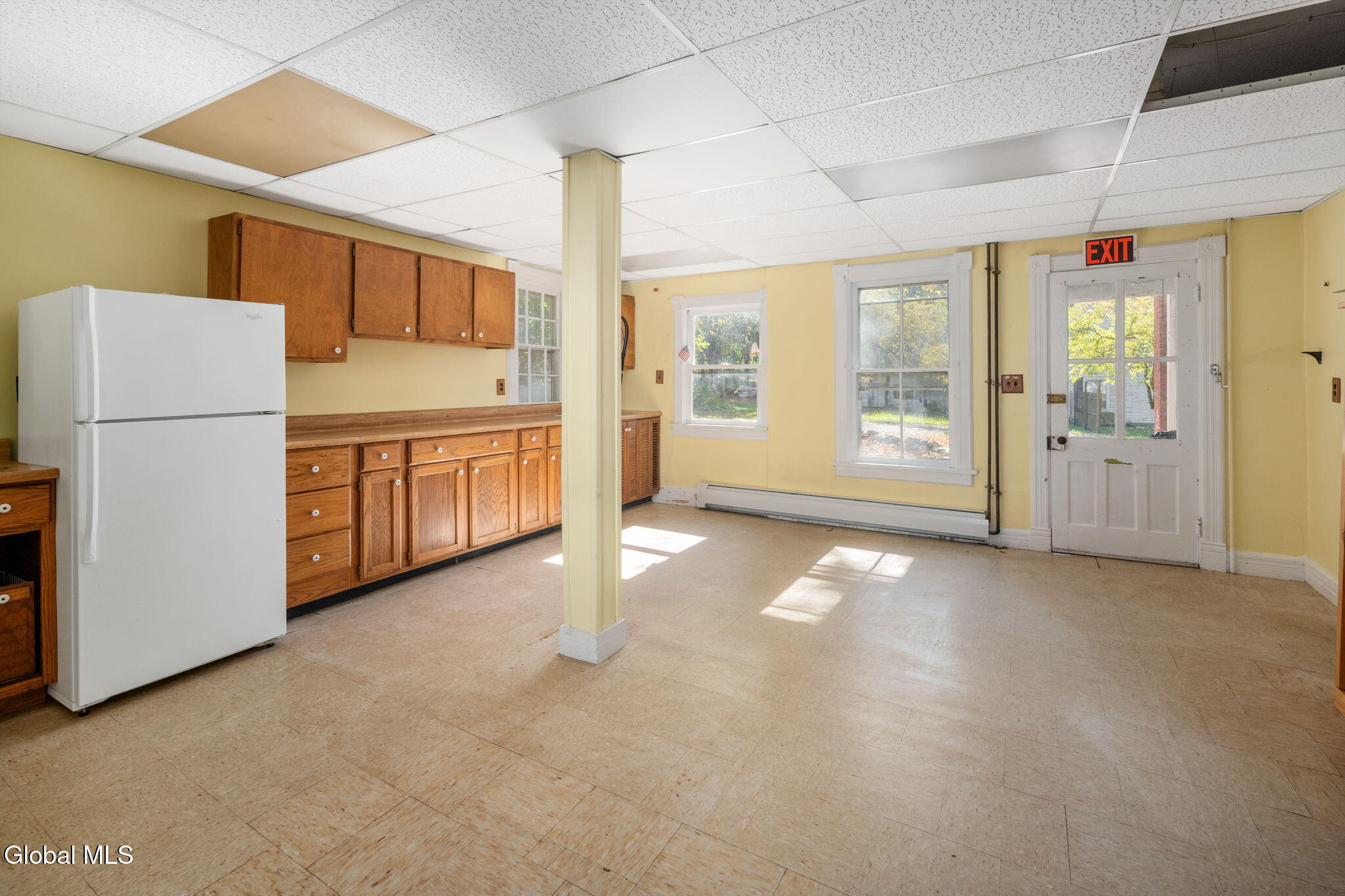 kitchen with wood cabinets, dropped ceiling