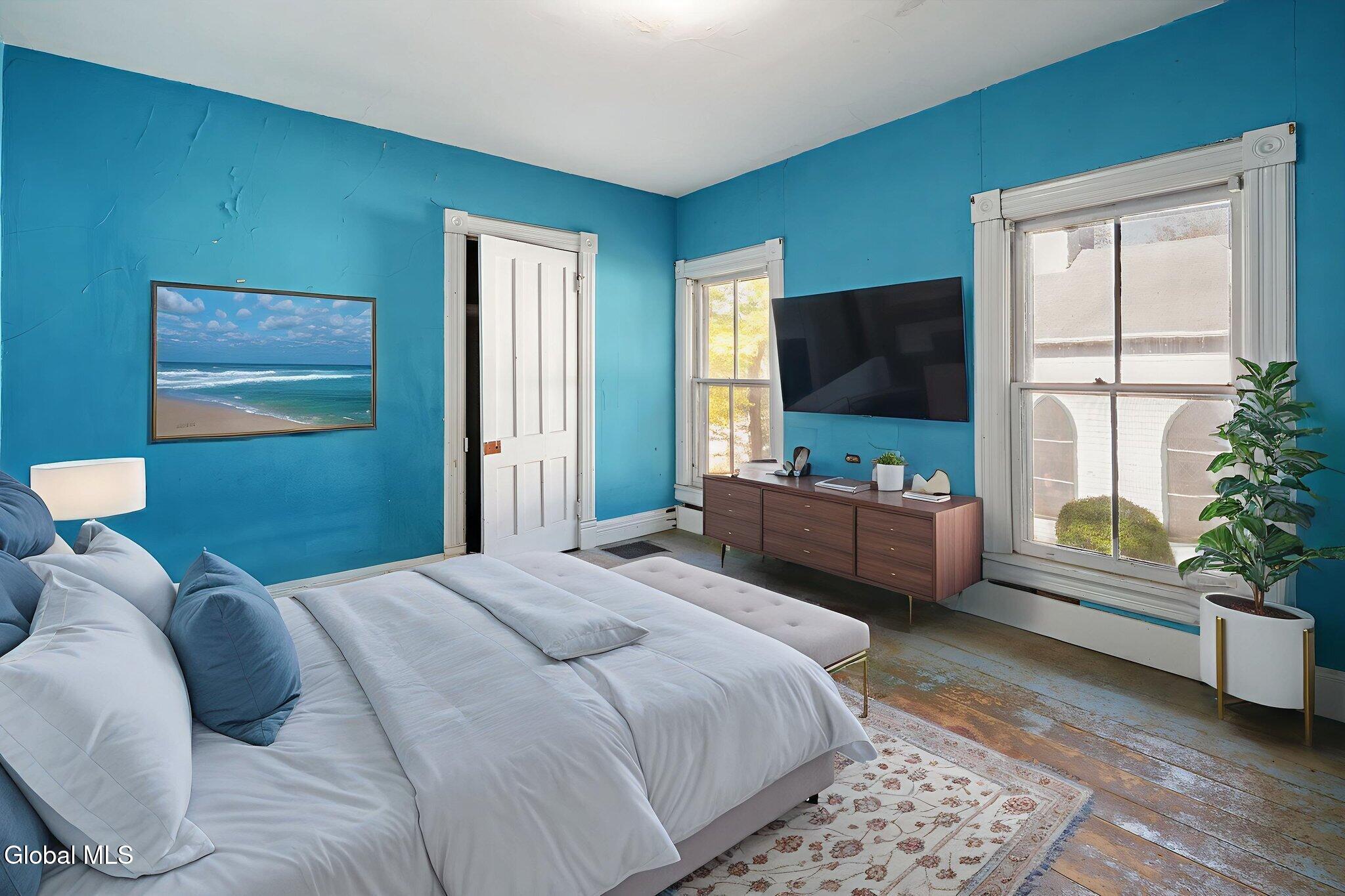 virtually staged bedroom with blue walls