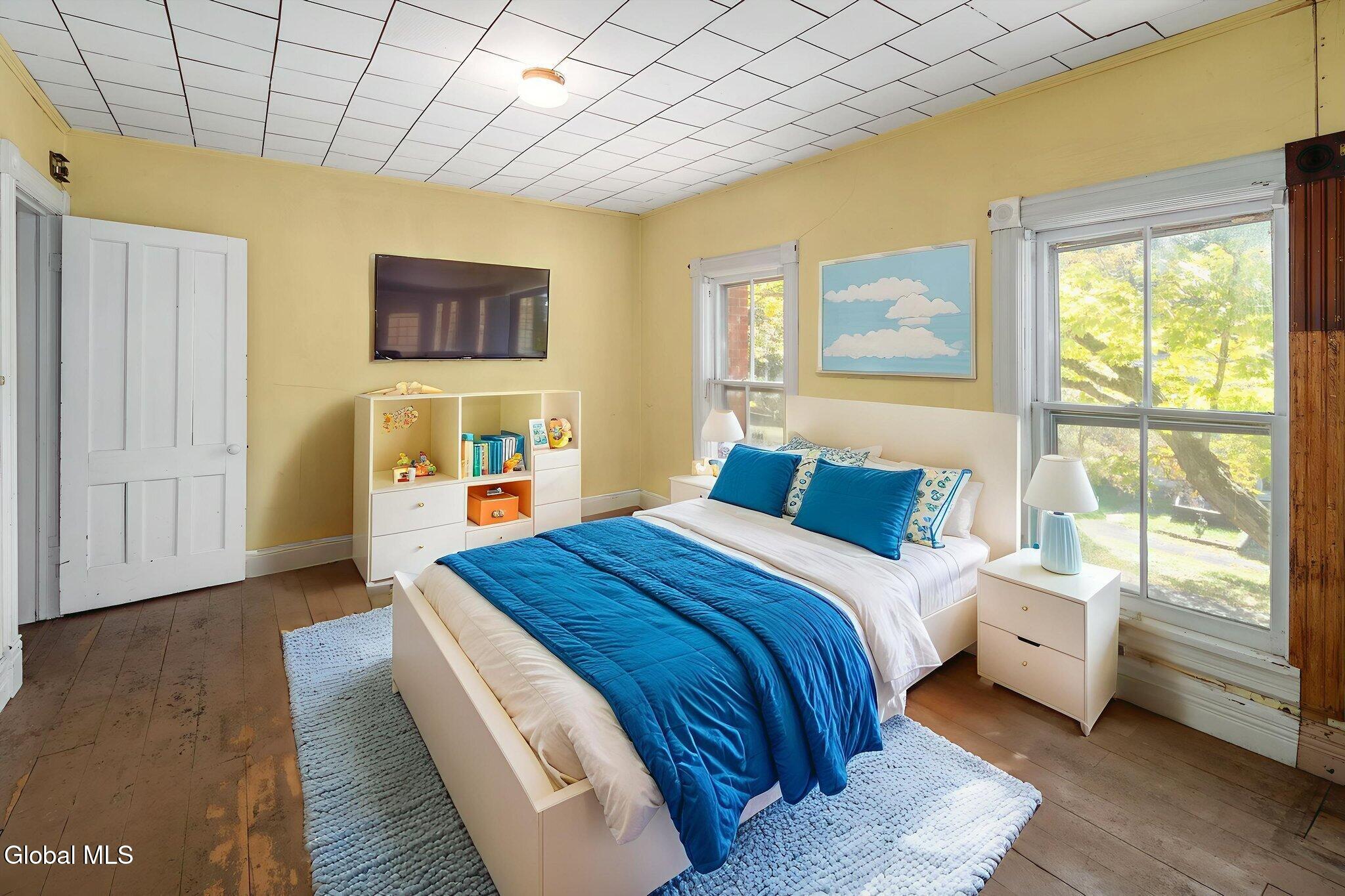 virtually staged bedroom with yellow walls