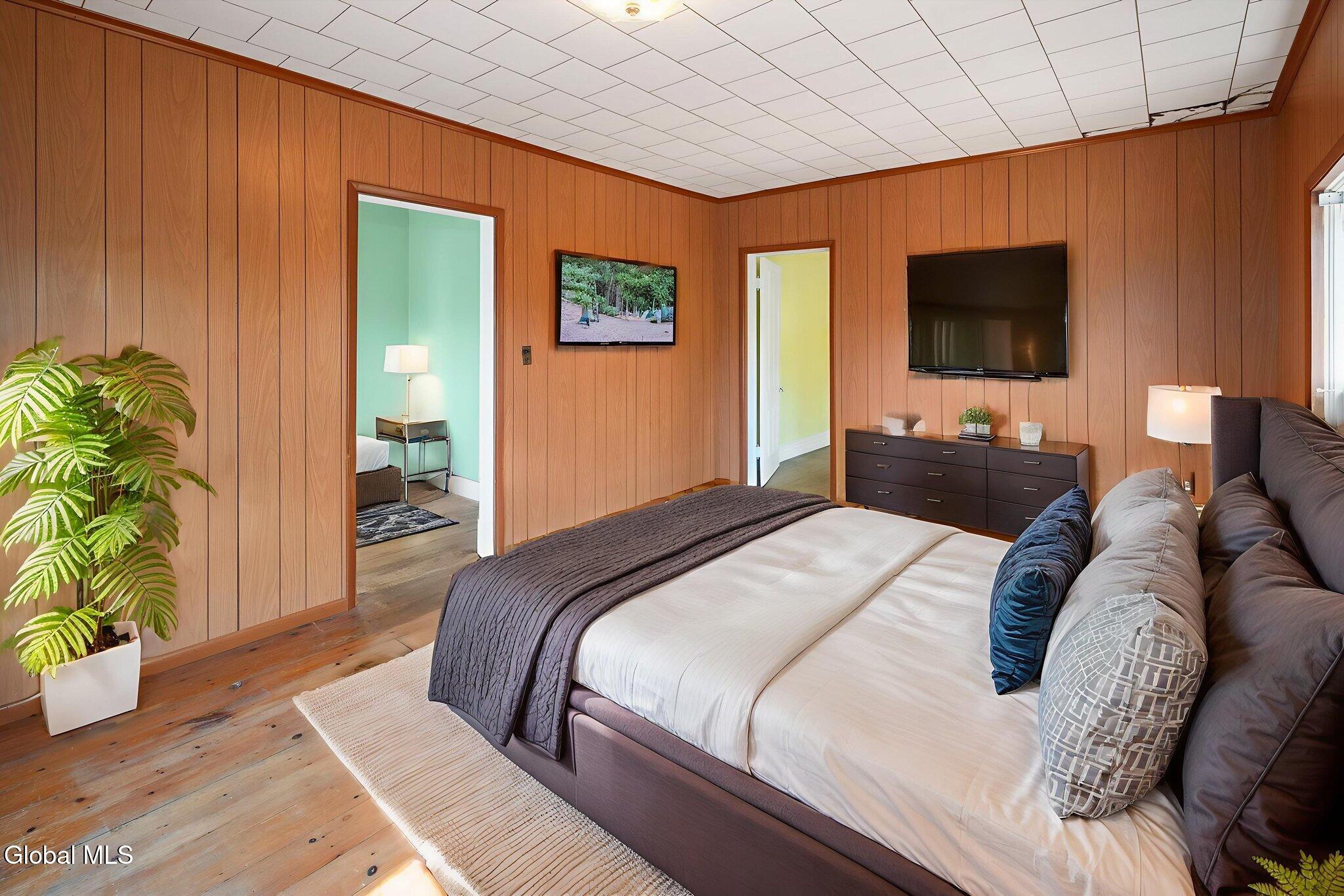 virtually staged bedroom with paneling