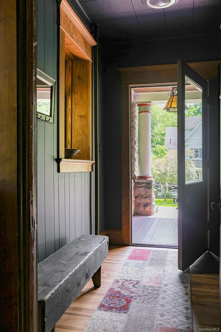 entry hall with blue siding
