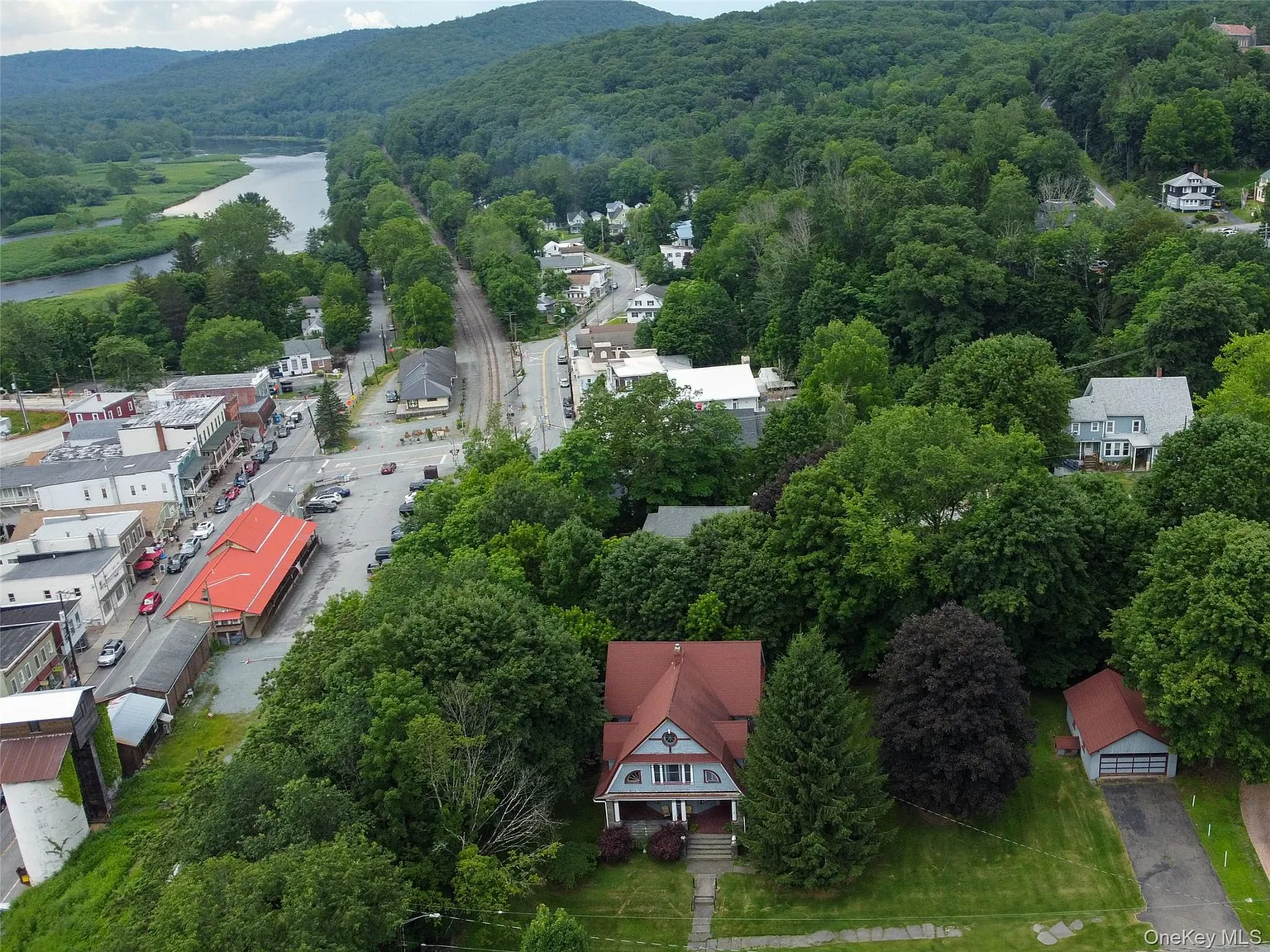 aerial view showing house and downtown beyond