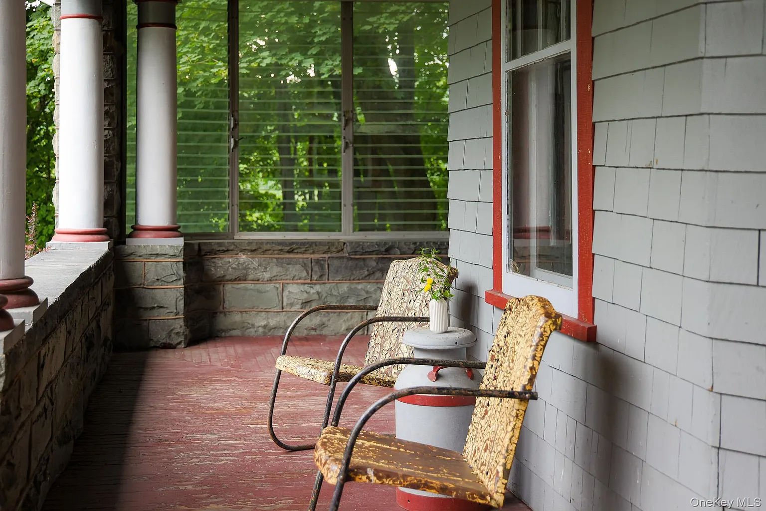 front porch with red painted floor, room for seating, and screened in on one side