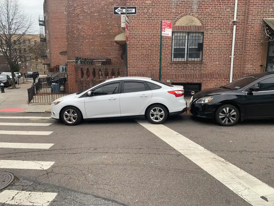 The NYC Council’s universal daylighting bill would prohibit vehicles from parking or standing within 20 feet of a crosswalk.
