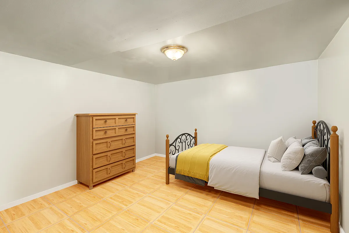 basement bedroom with grey walls