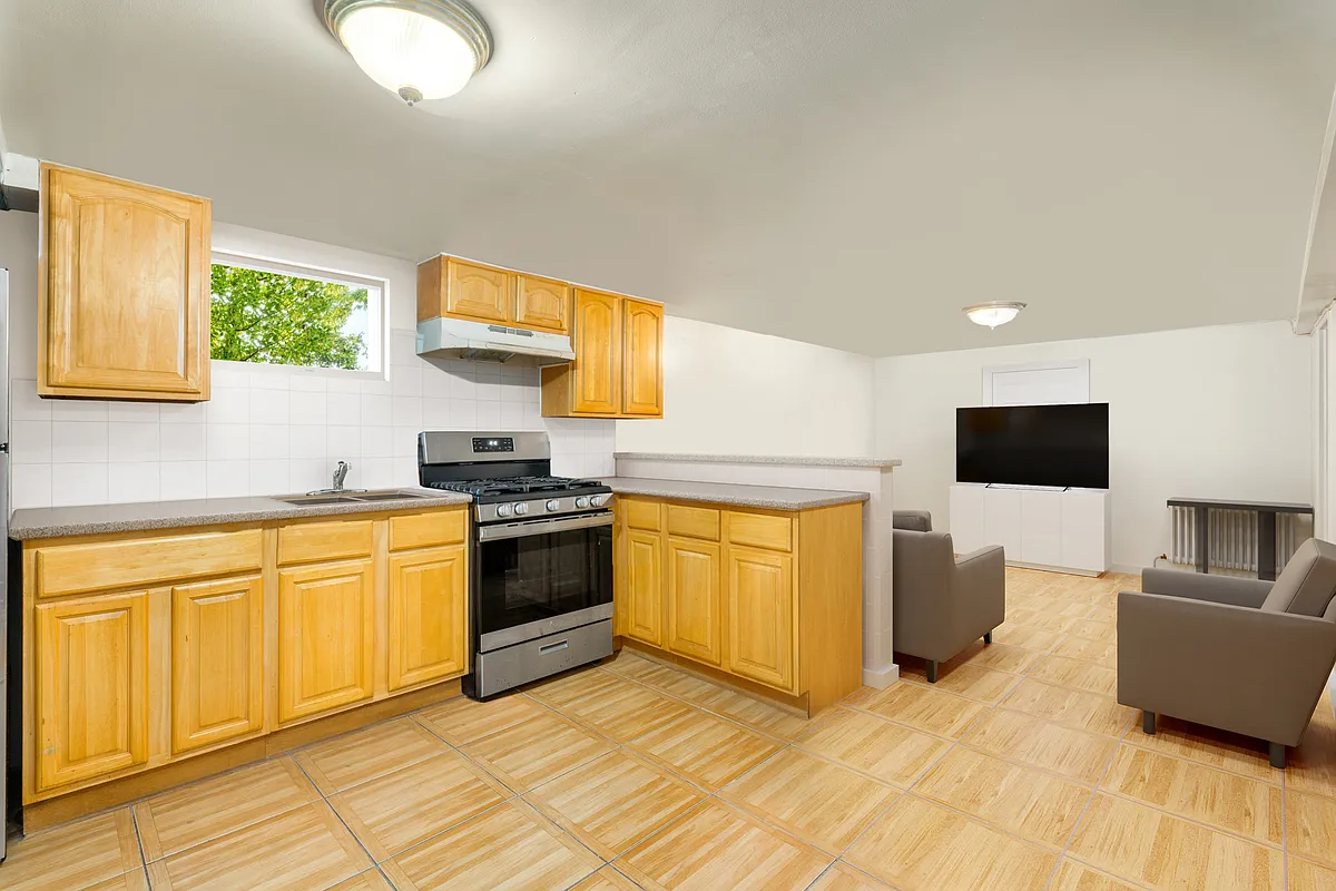basement kitchen with wood cabinets