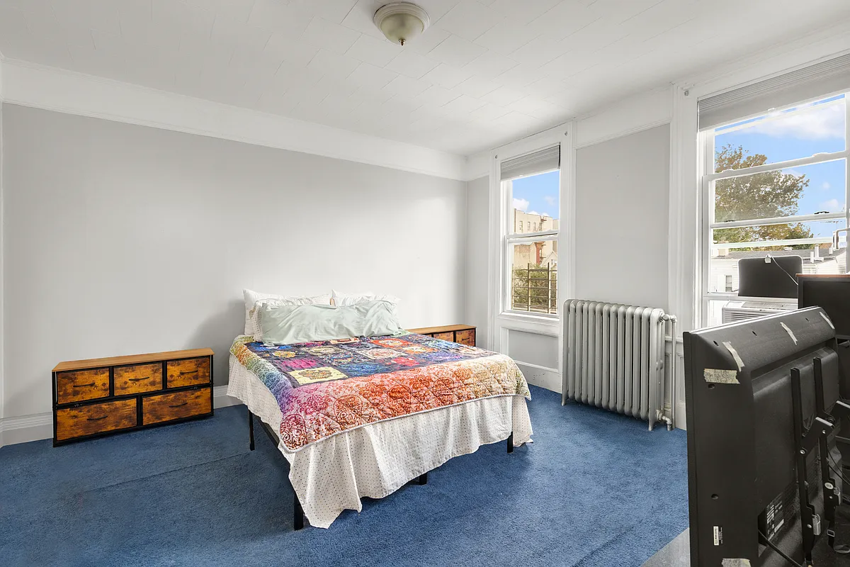 bedroom with picture rails, blue carpet
