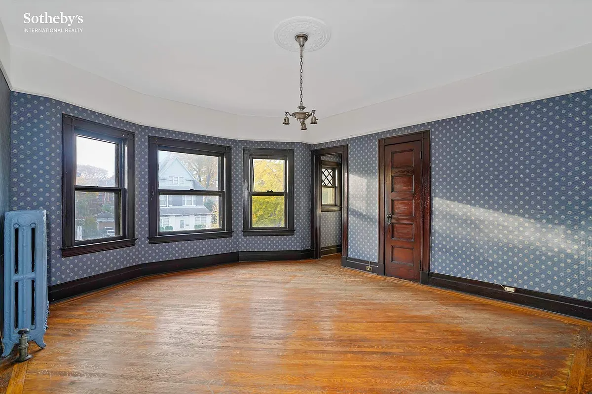 bedroom with blue and white wallpaper