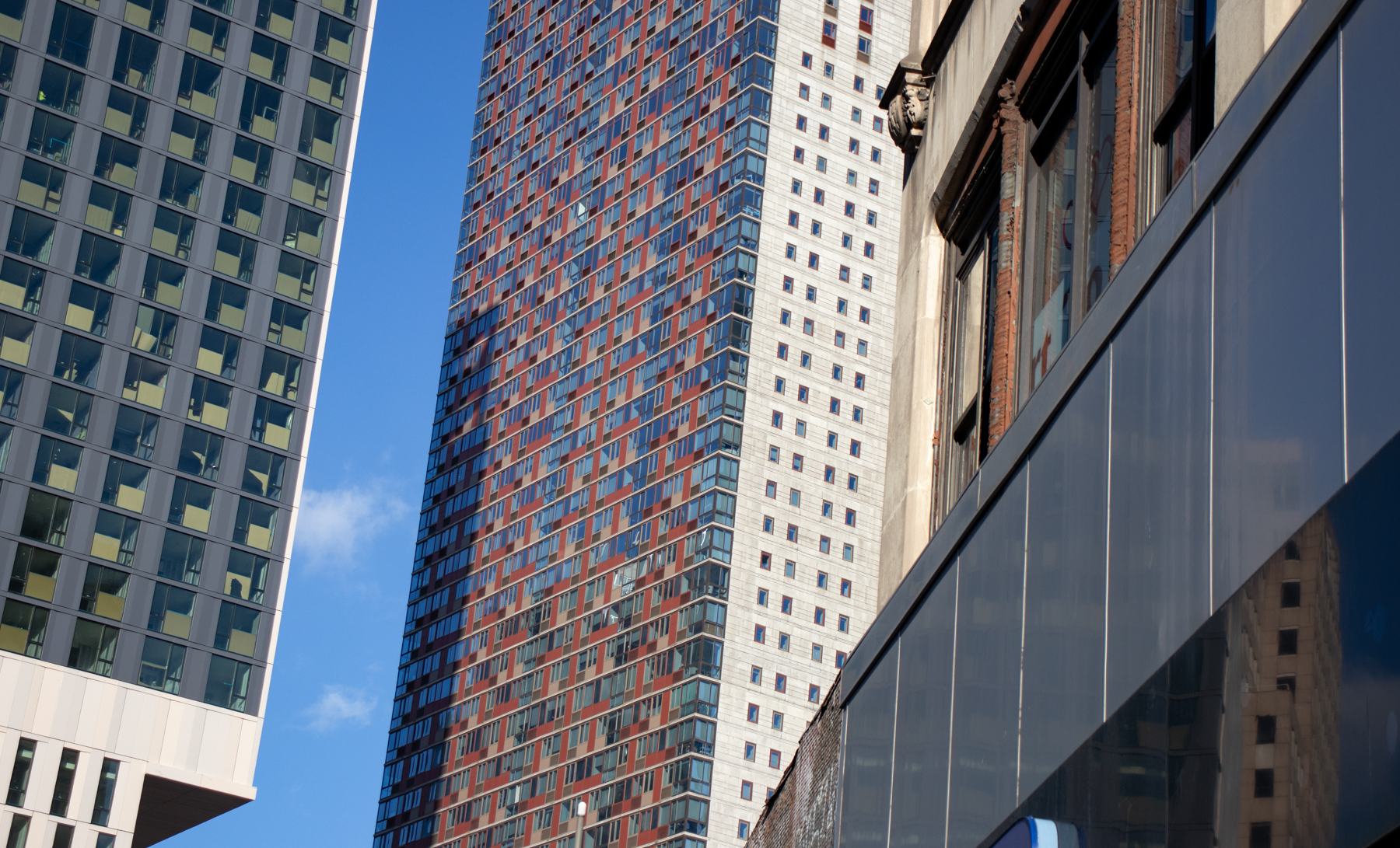 looking up at a mix of old and new buildings in downtown brooklyn