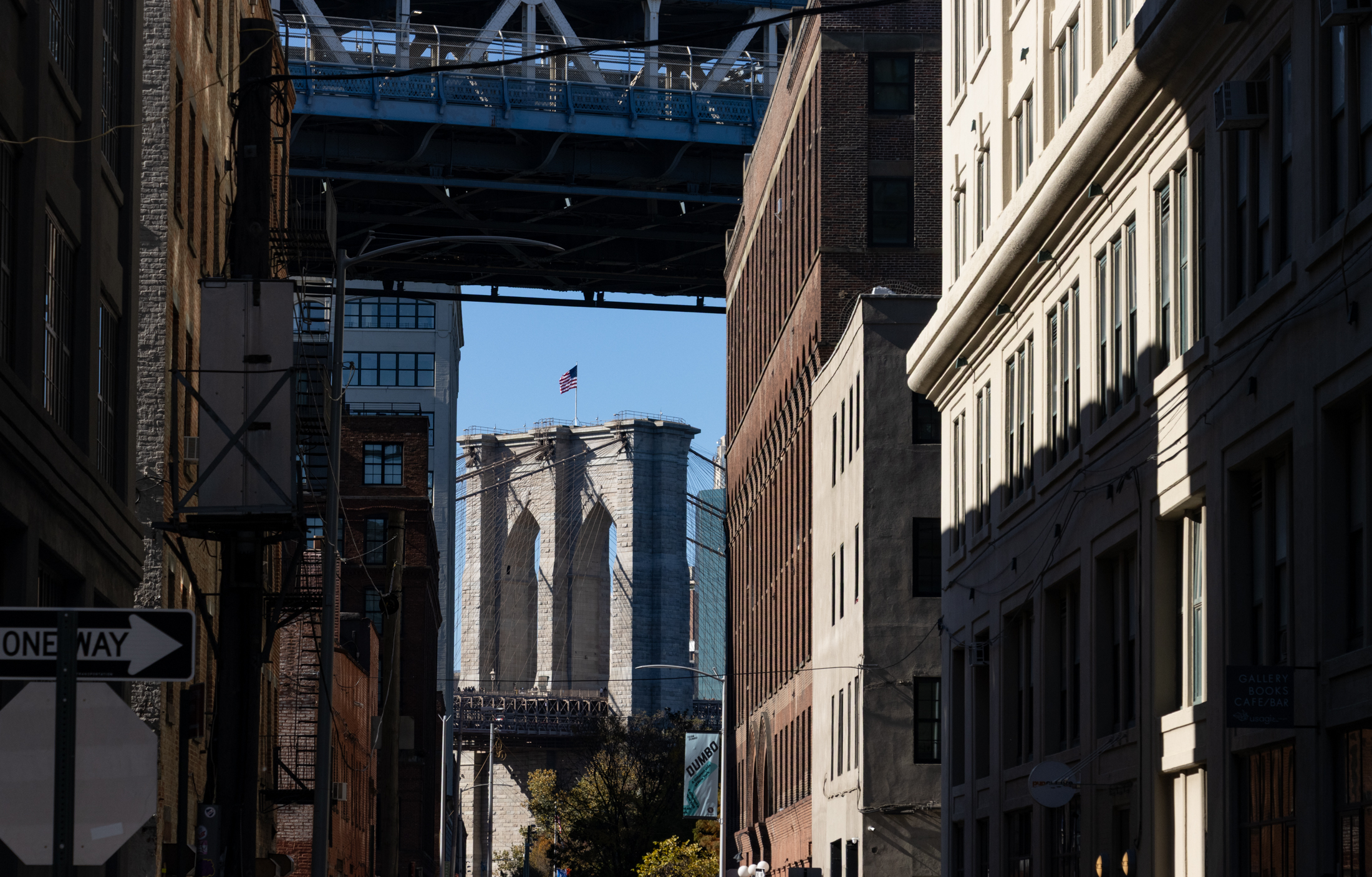 view to the Brooklyn Bridge framed by Dumbo buildings