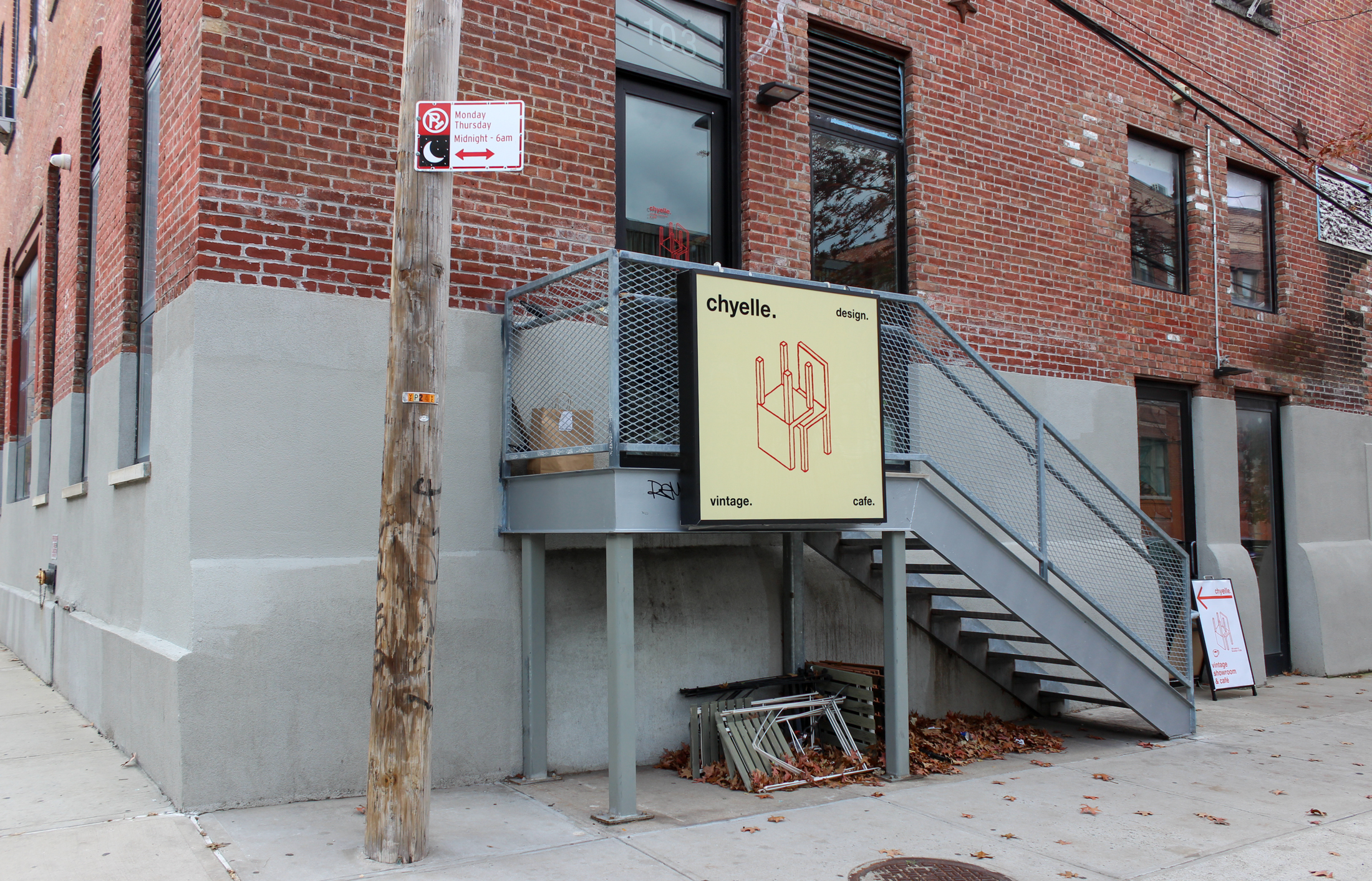 exterior of a brick building with a yellow sign for chyelle
