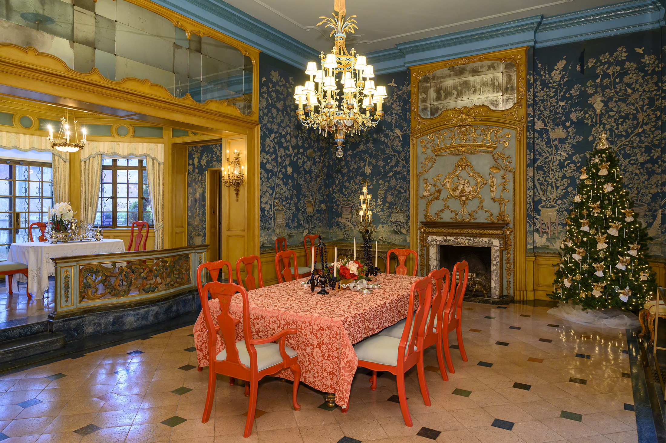 dining room with red chairs, christmas tree