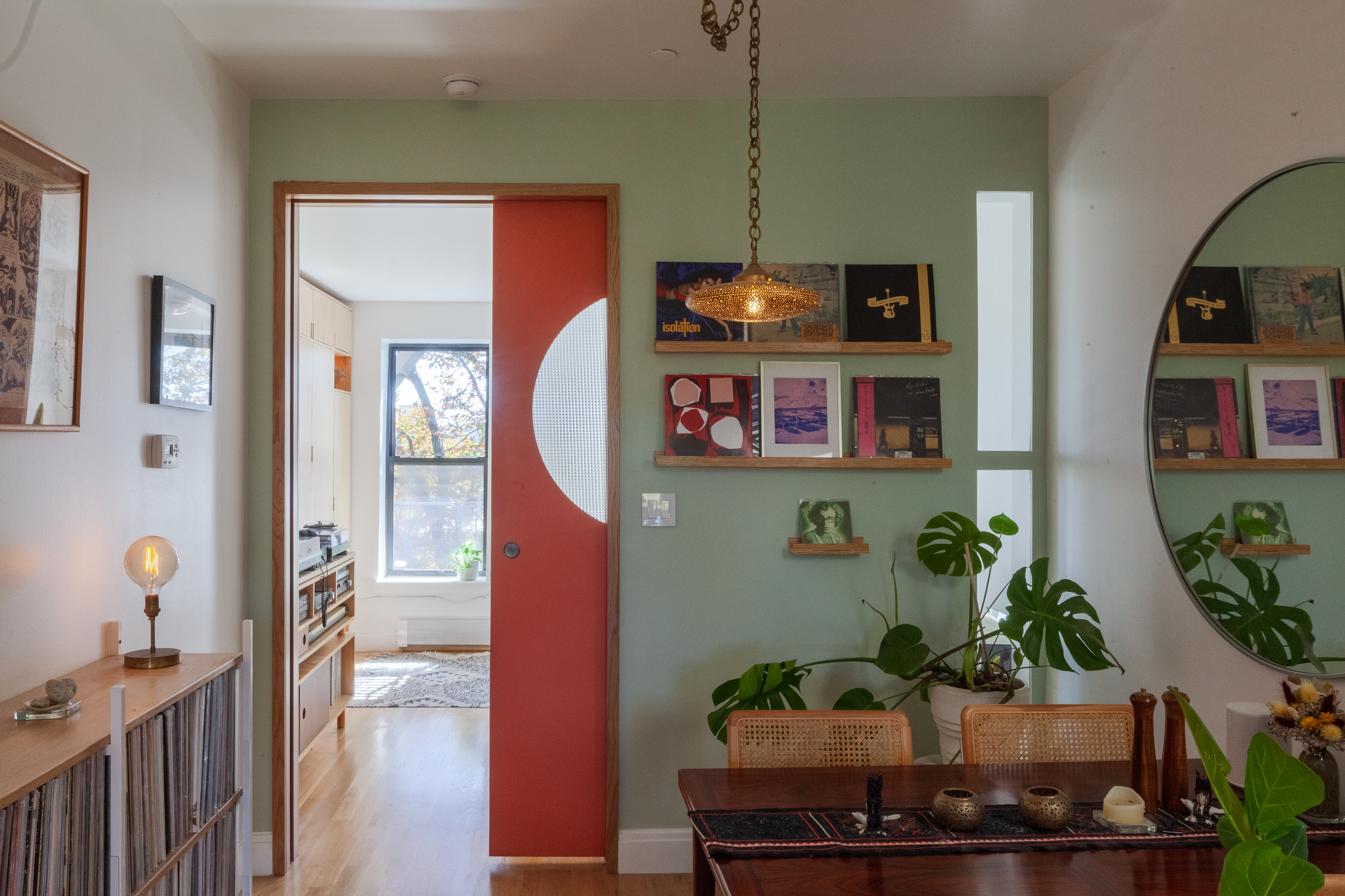 DINING INTO BEDROOM HALF OPEN RED DOOR