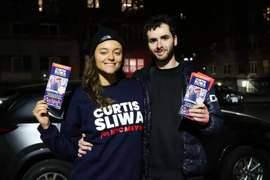 A young couple hits the polls in Brighton Beach for Republican mayoral candidate Curtis Sliwa.