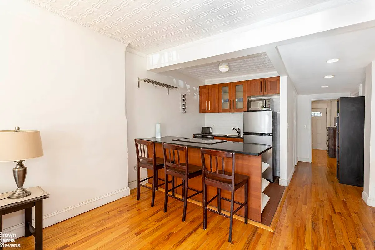 garden level open kitchen with peninsula with bar seating