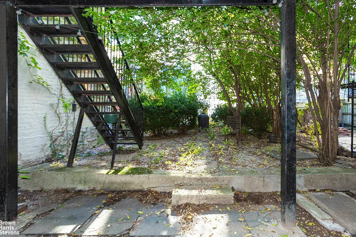 rear yard with gravel, shrubbery