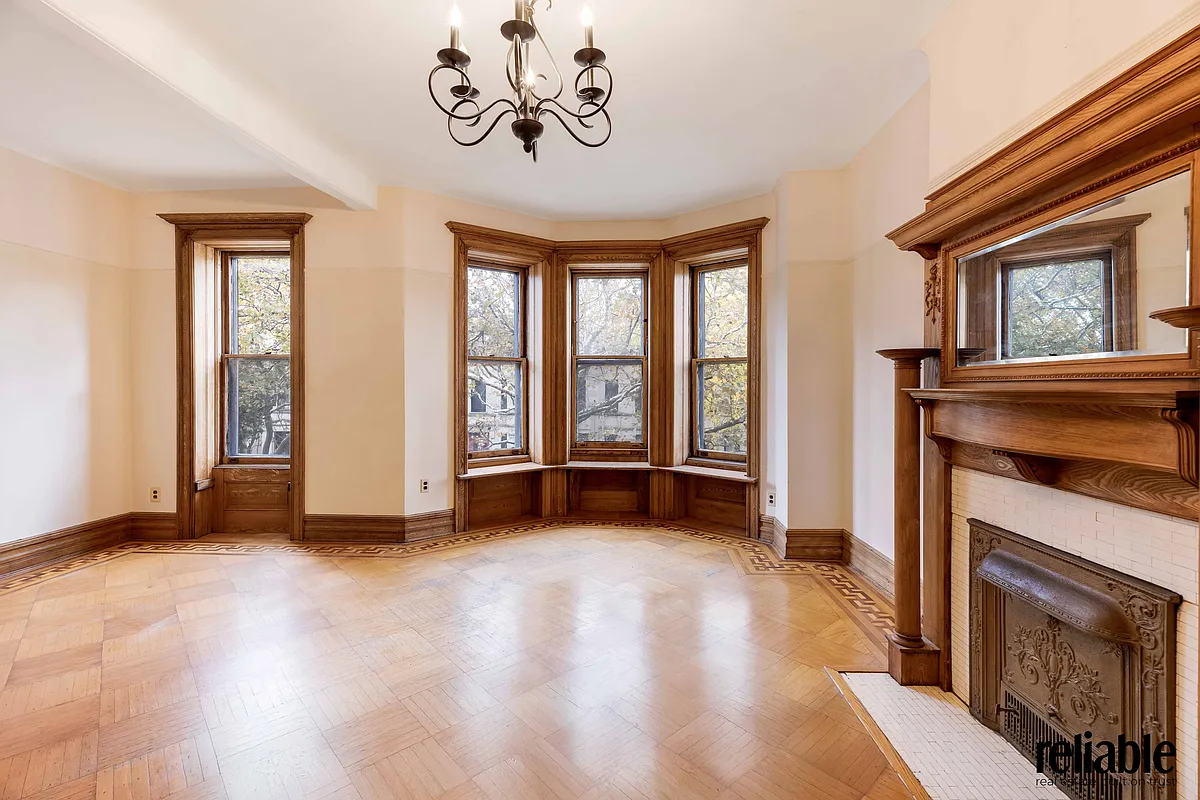 bedroom with window seat, mantel
