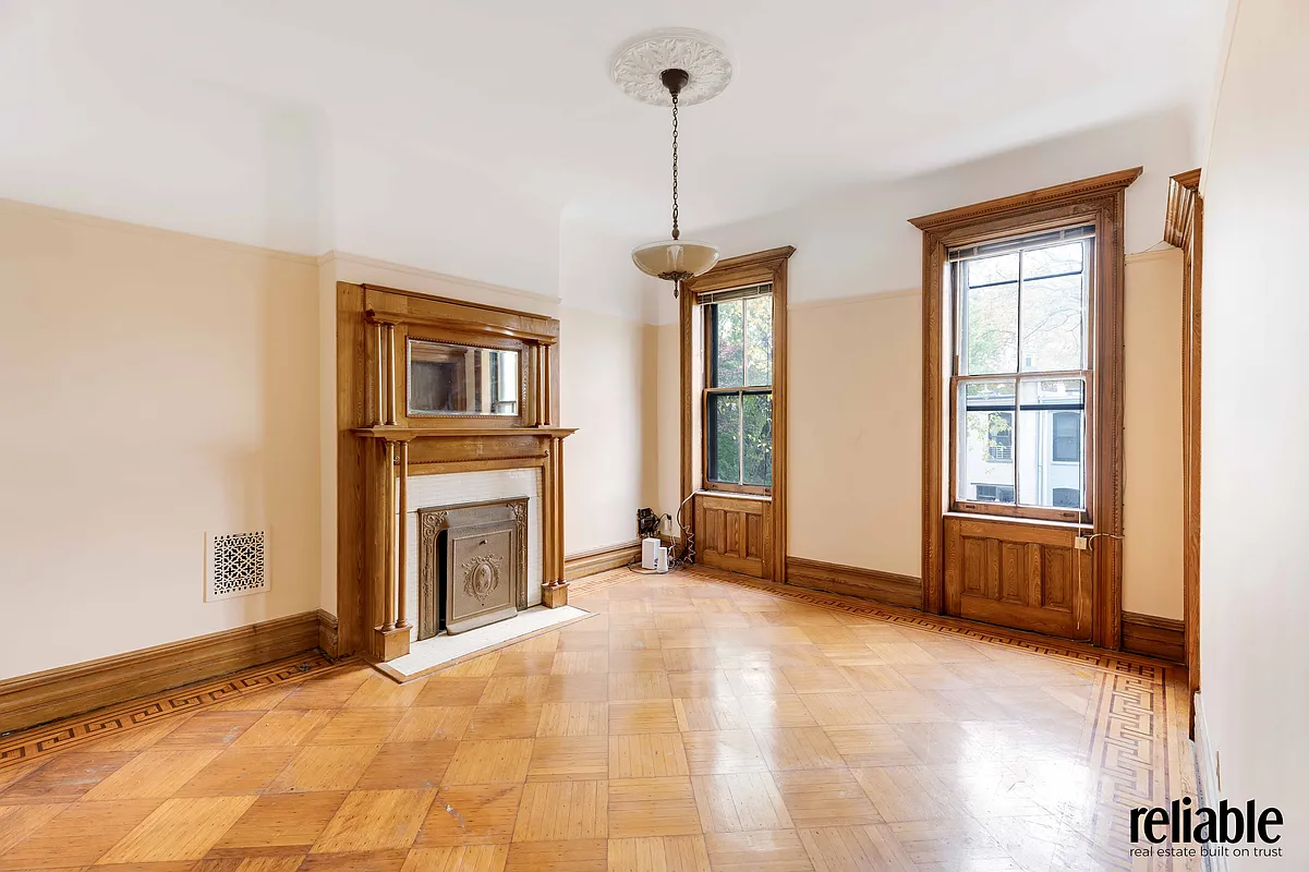 bedroom with columned mantel
